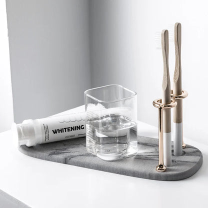 Minimalist Marble-Like Toothbrush Holder With Metal Coils