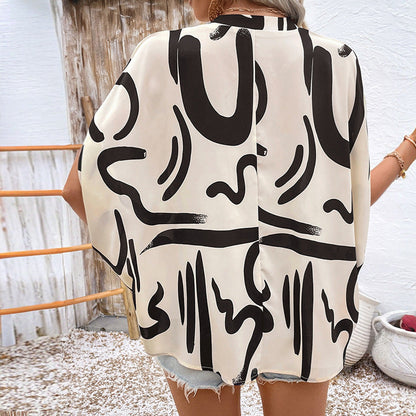 Women's blouse – Loose fit – Batwing sleeves – V-neck – Geometric print