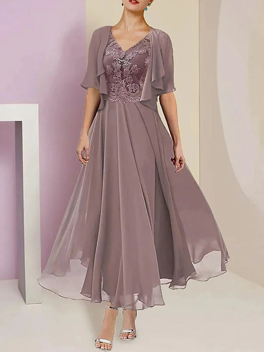 Robe longue femme – Tissu luxe – Coupe fluide – Décolleté V – Manches mi-longues – Buste brodé