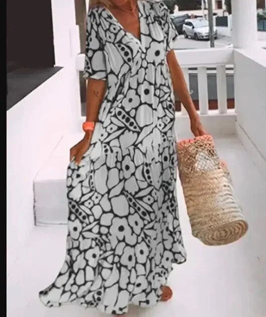 Women's long dress – Flared cut – Breathable fabric – V-neck – Short sleeves – Floral print